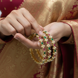Four Gold-Toned Bangles